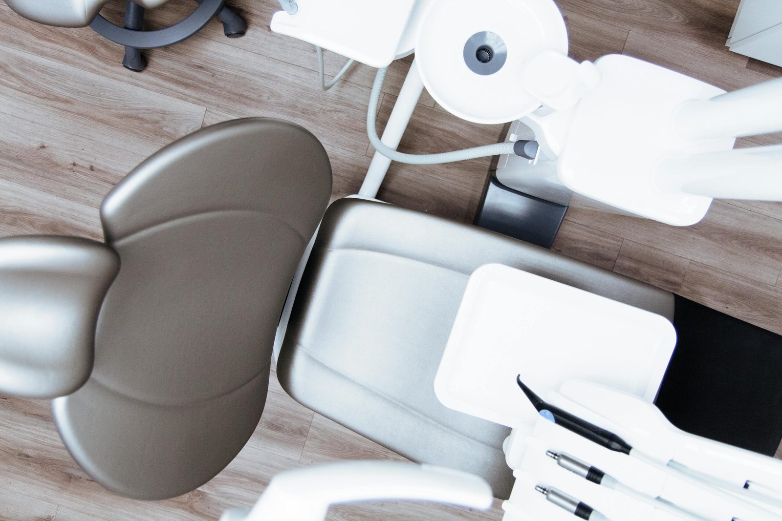 High-angle view of a modern dental chair and equipment setup in a professional clinic.